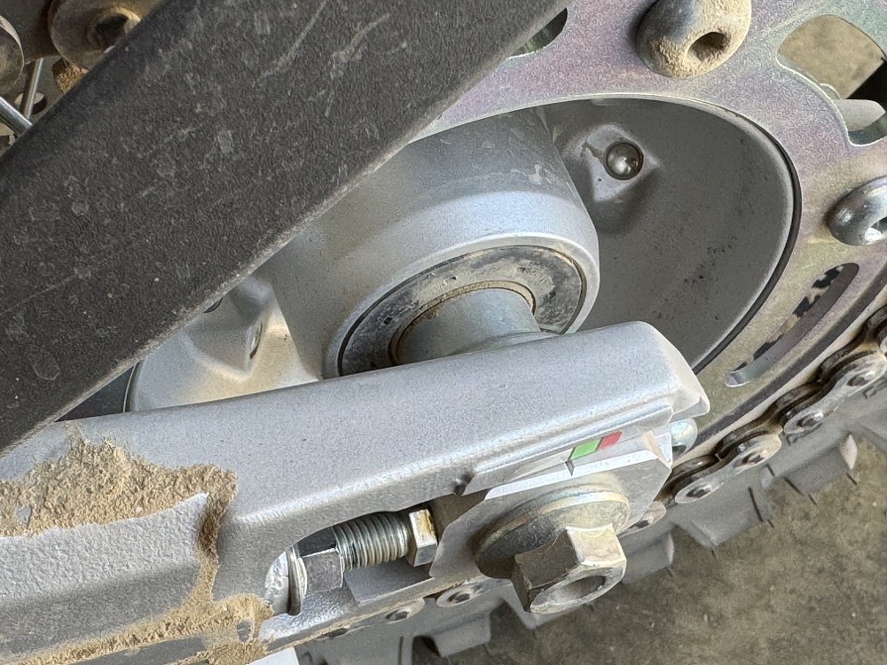 Dirty and dusty motorcycle hub with bear seal visible