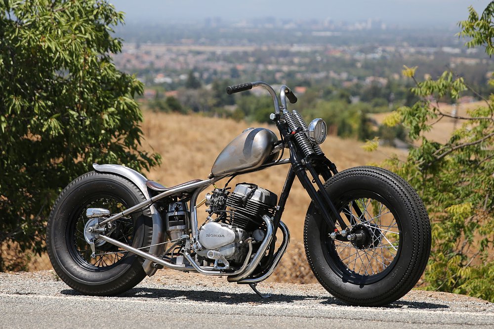 right side view of small bobber custom in bare metal