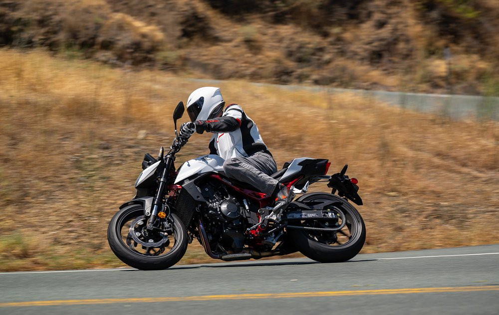 Lance riding a white Honda CB750 Hornet in central California