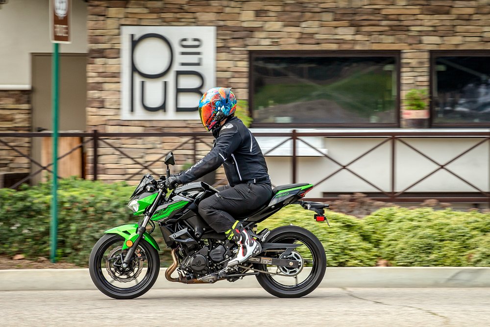 Spurgeon riding the green and black Z400 on a city street