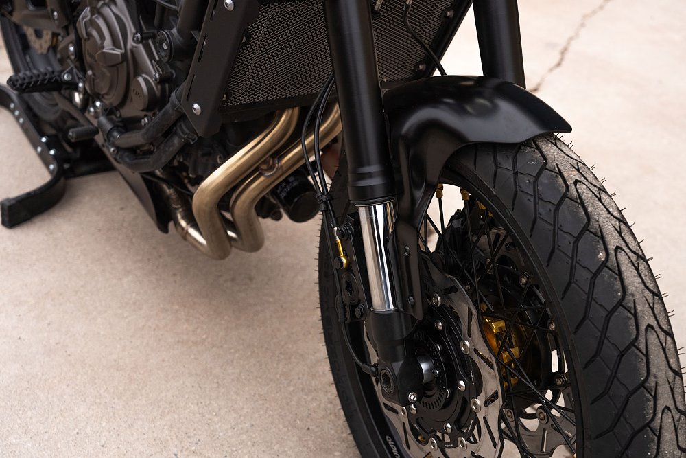 close view of the front wheel, suspension, and brakes