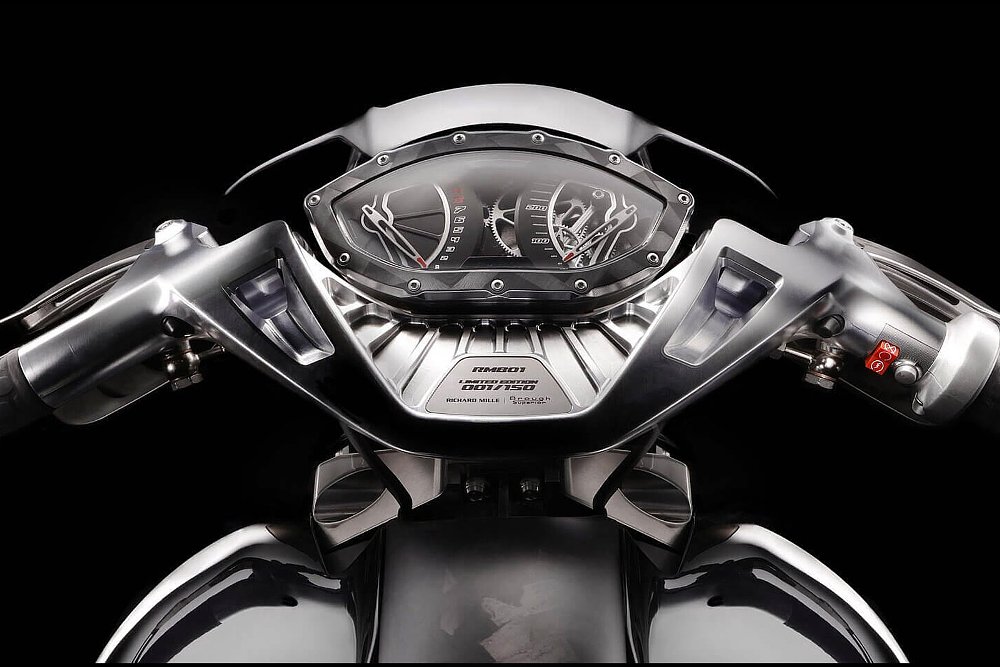 view of the gauges showing exposed inner workings like the gears of a watch