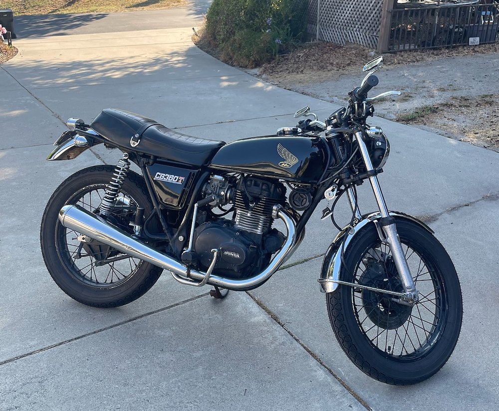the black Honda CB360T parked in the driveway in California