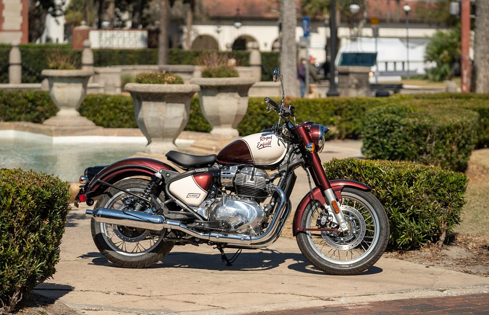 red and white Classic 650 parked in front of historic building in St. Augustine