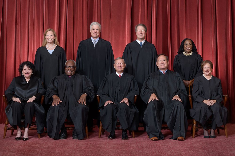 The U.S. Supreme Court pose for a formal group picture. 