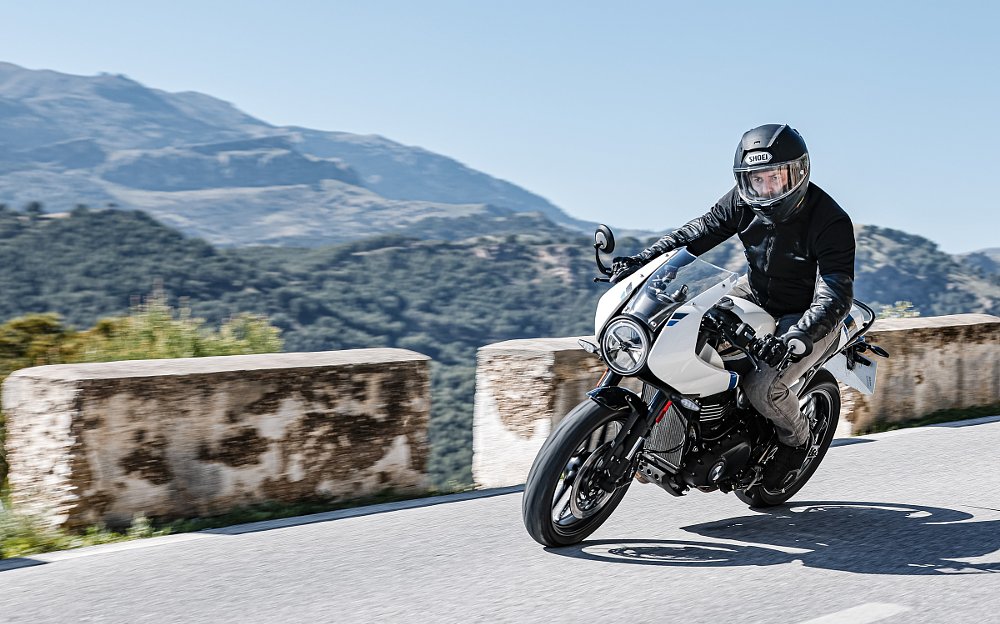 white Thruxton ridden on a mountain road in Spain