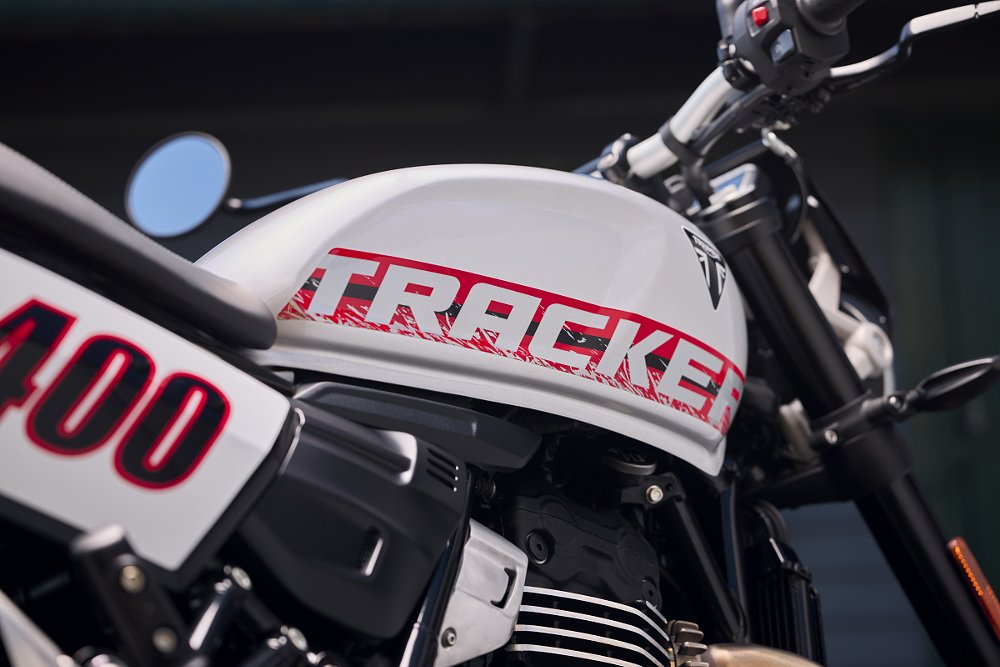 close view of the 'TRACKER' graphics on the white tank and the '400' number plate on the side