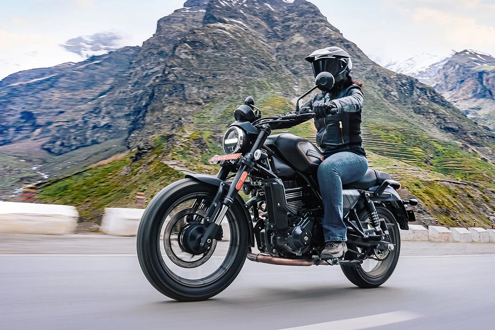 rider on a black X 440 on a country road in India