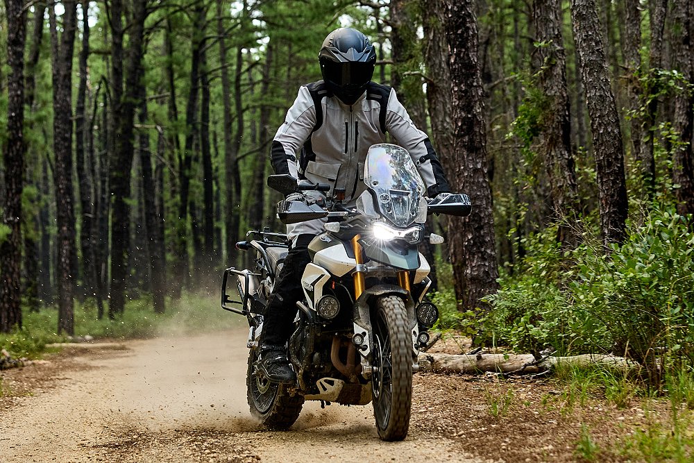An adventure rider slides the rear wheel of his Triumph Tiger 900.