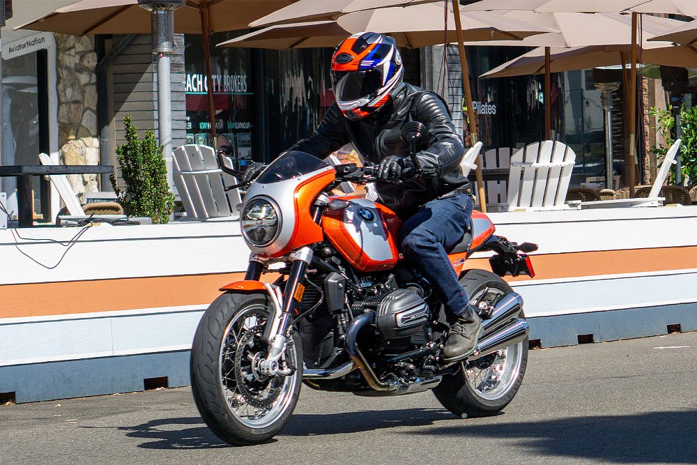 Dustin rides the R 12 S through a city block.