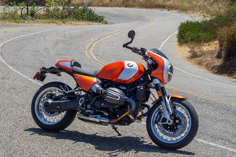 The R 12 S staged before an S-curve on a canyon road.