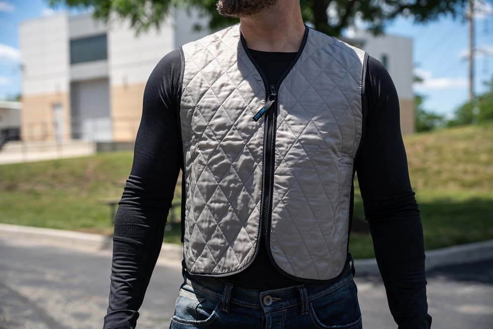 rider wearing a gray cooling vest over a black base layer shirt