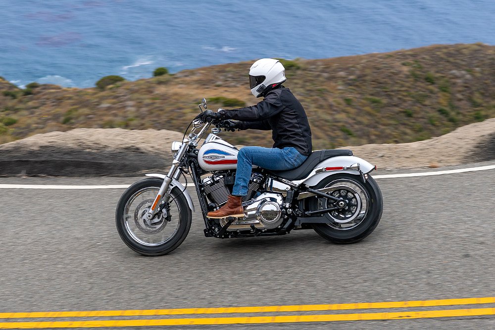 Dustin rides the Super Glide on a cliffside road.