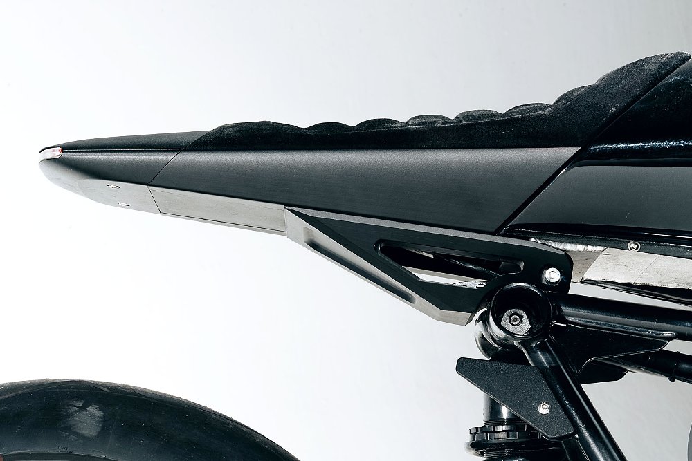 studio photo of close view of the slim, tapered tail section and seat