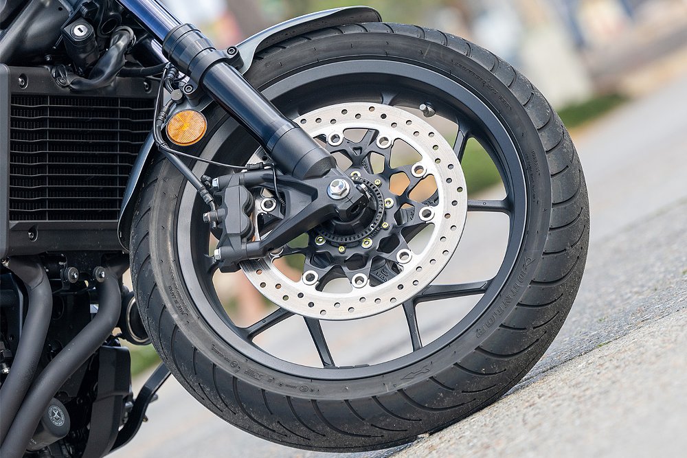 A close up of the Rebel 1100T's front wheel.