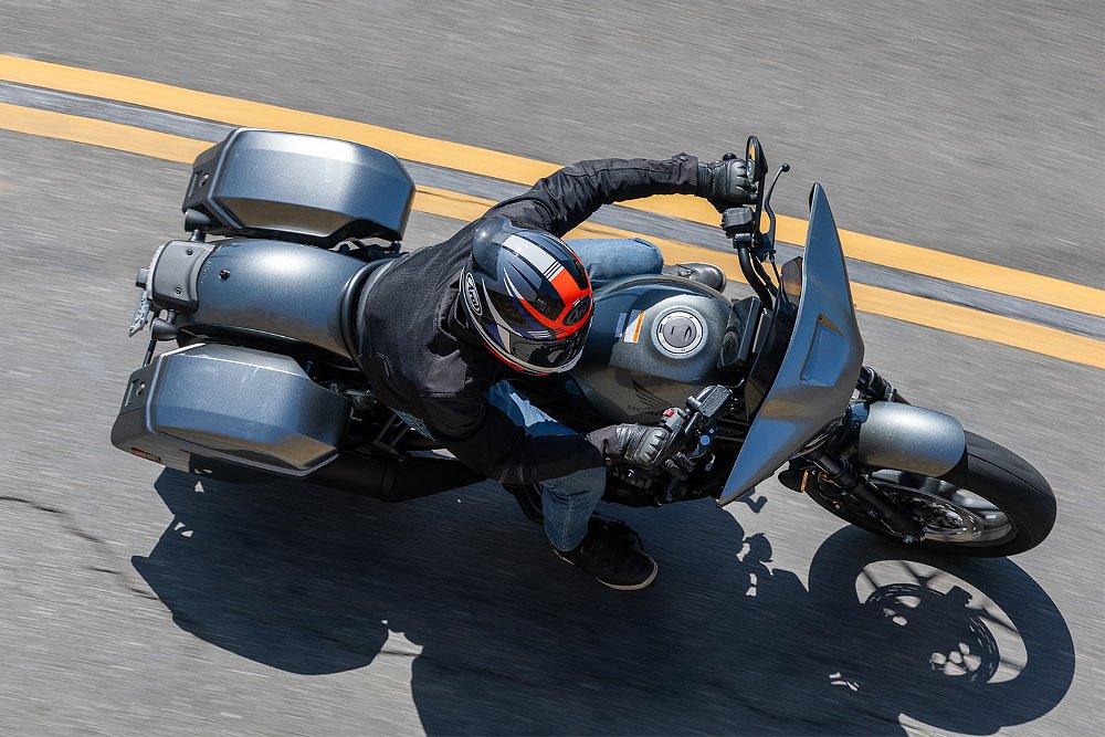 A top-down shot of Dustin riding the Rebel 1100T on a canyon road.