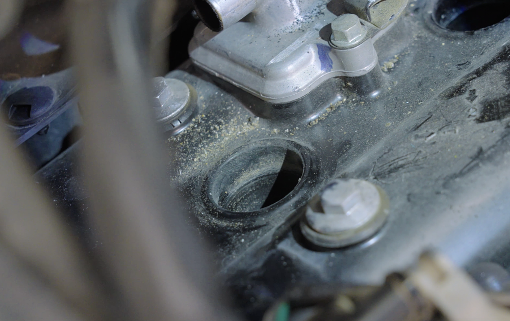 Dirt around the spark plug opending.