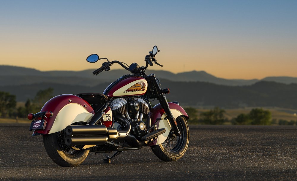 rear three-quarters view of the red and cream Indian parked in front of wide-open Western landscape