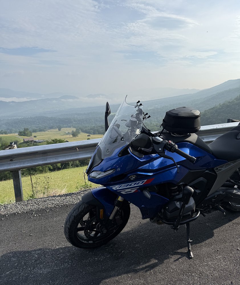 the blue BMW at a scenic mountain overlook