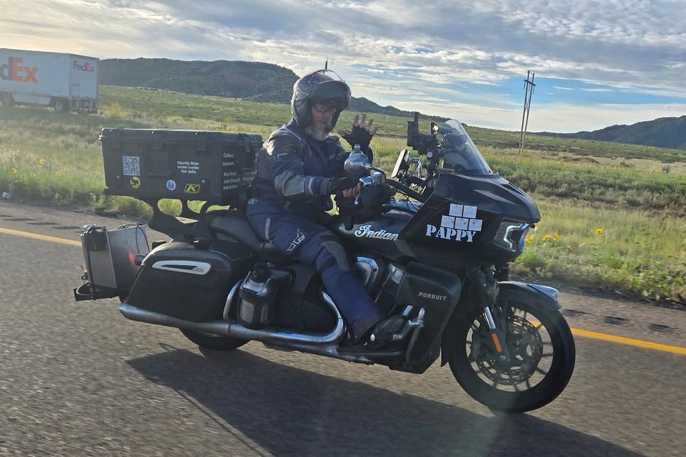 Patrick Cornell rides his Indian Pursuit down a highway.