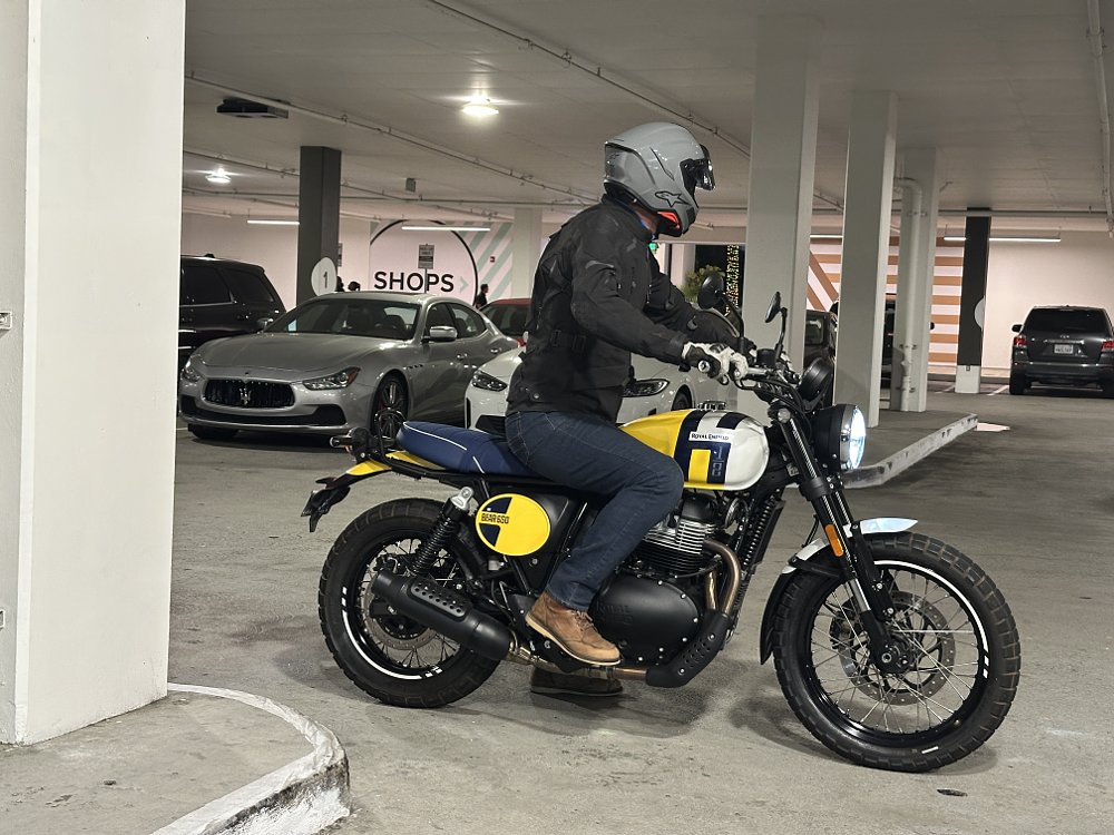2026 Royal Enfield INT Bear 650 stopped in a parking garage with a rider looking for traffic.