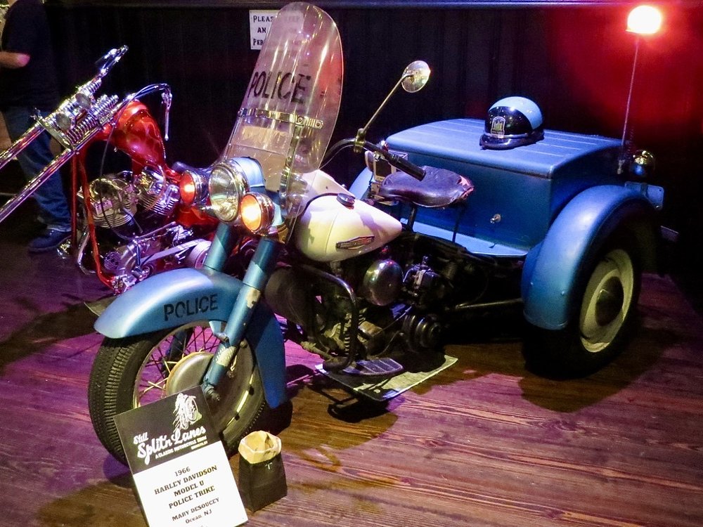 a blue 1966 Harley-Davidson Model U police trike