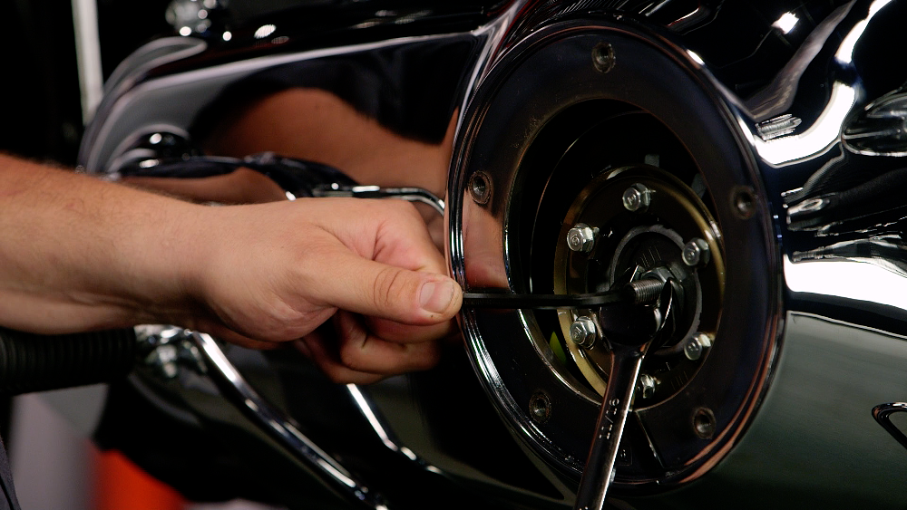 Loosening the jam nut on a clutch adjuster