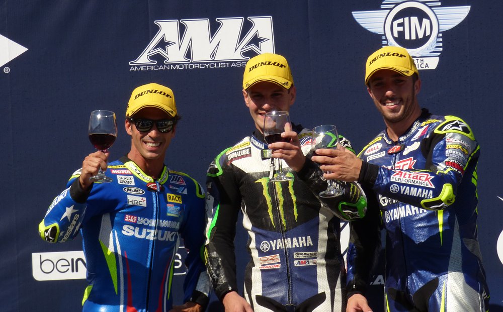 podium celebration with a glass of wine