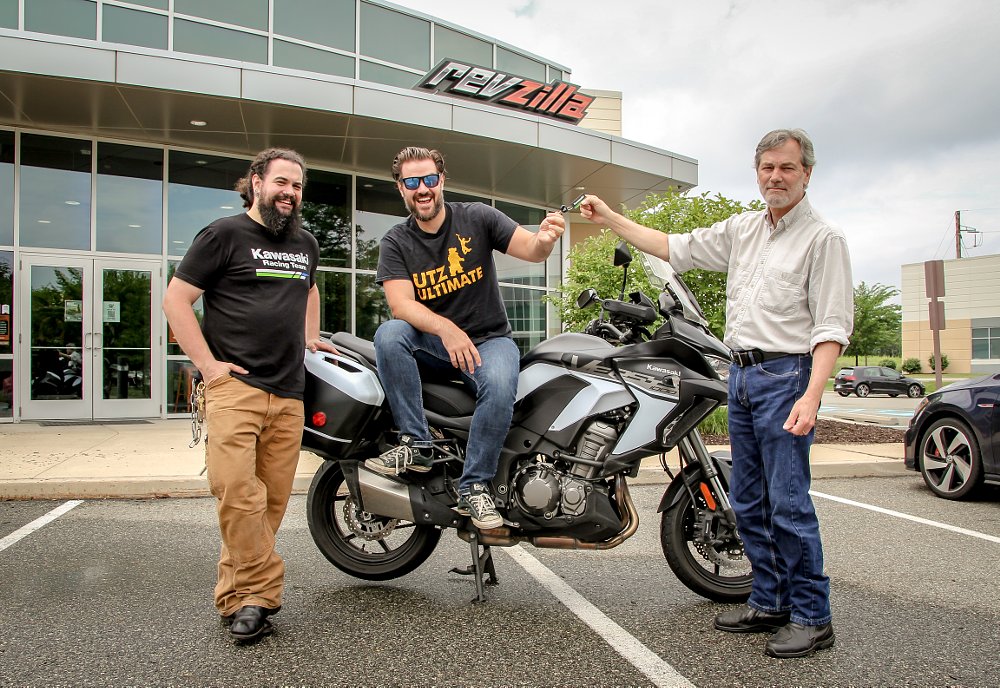 Lance Oliver, Lemmy, and Spurgeon Dunbar with a Kawasaki Versys 1000