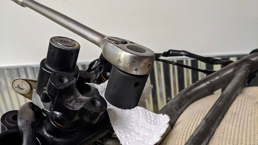 Remove motorcycle steering stem nut