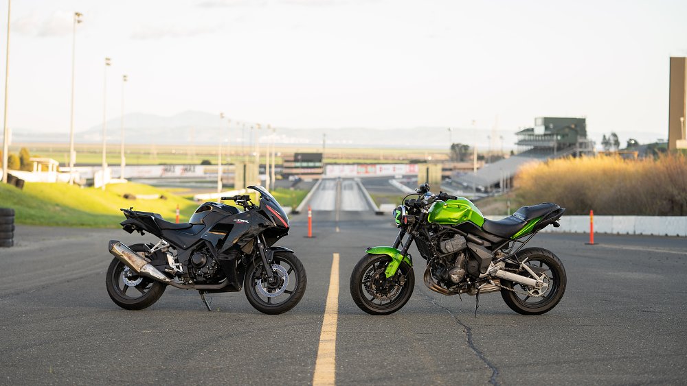 Kawasaki Versys 650 and Honda CBR300R posed on the drag strip at Sonoma Raceway