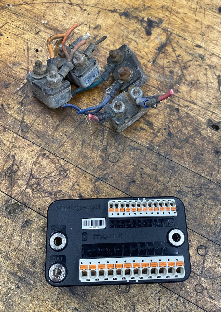 new and old parts on work bench
