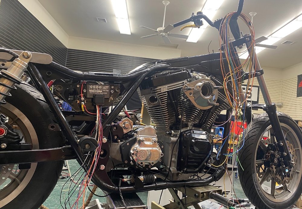 wiring being added to partially assembled motorcycle