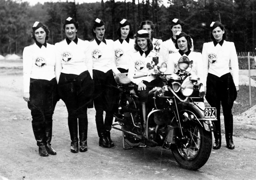 women's motorcycle club in lineup in matching uniforms