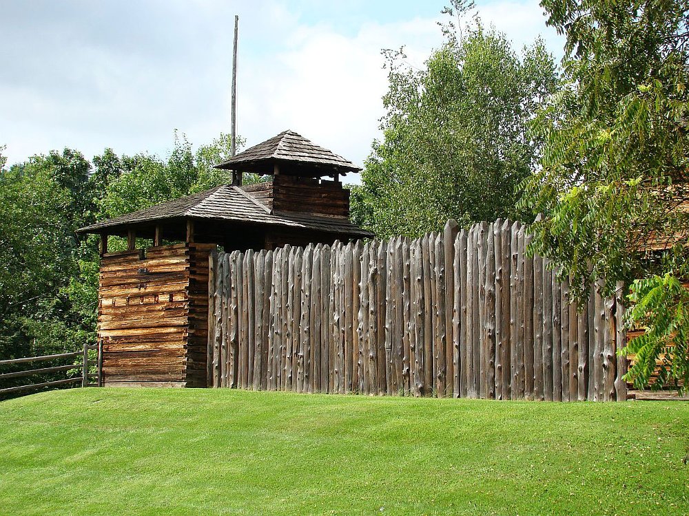 a photo of the rustic wood log stockade that had two levels that made up the Cuchetank village