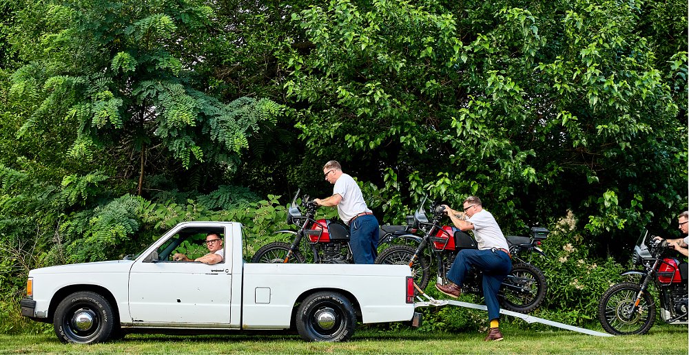 composite photo of loading a motorcycle into the truck bed