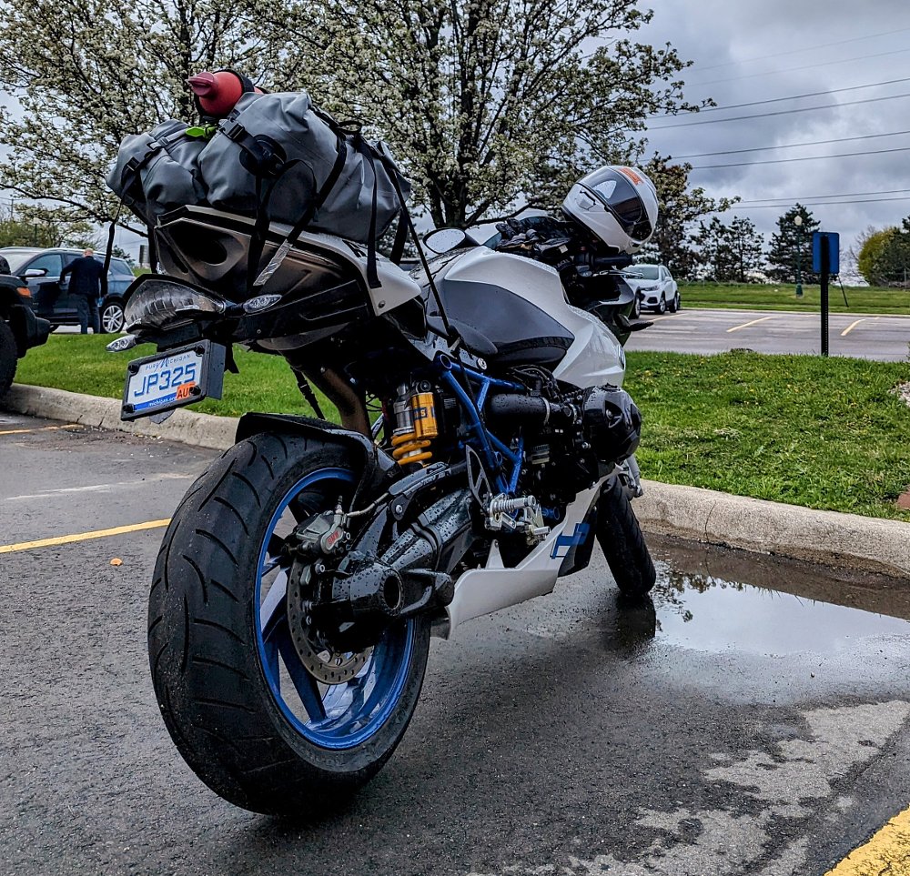 rear view of the HP2 Sport with luggage strapped to the minimal tail section