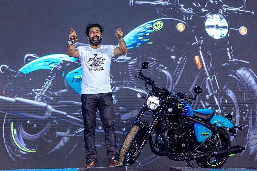 Siddhartha Lal on stage acknowledging the crowd alongside the Shotgun 650