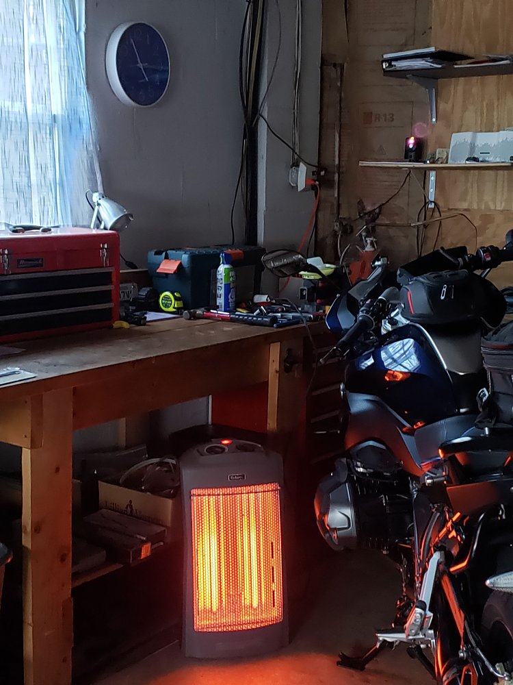 heater in the garage beside the motorcycle