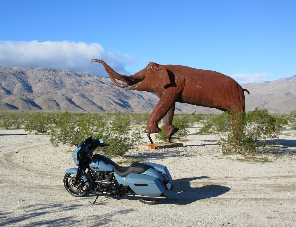 Street Glide parked in front of a giant sculpture of an elephant in the desert