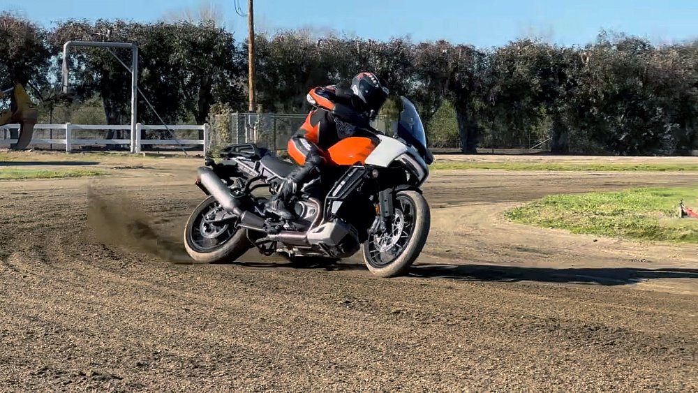 Harley-Davidson Pan America sliding around a turn on a dirt track