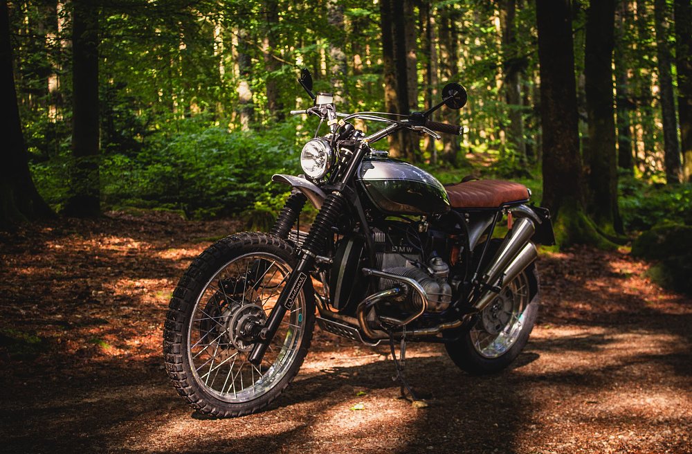 custom BMW in a shady wooded area