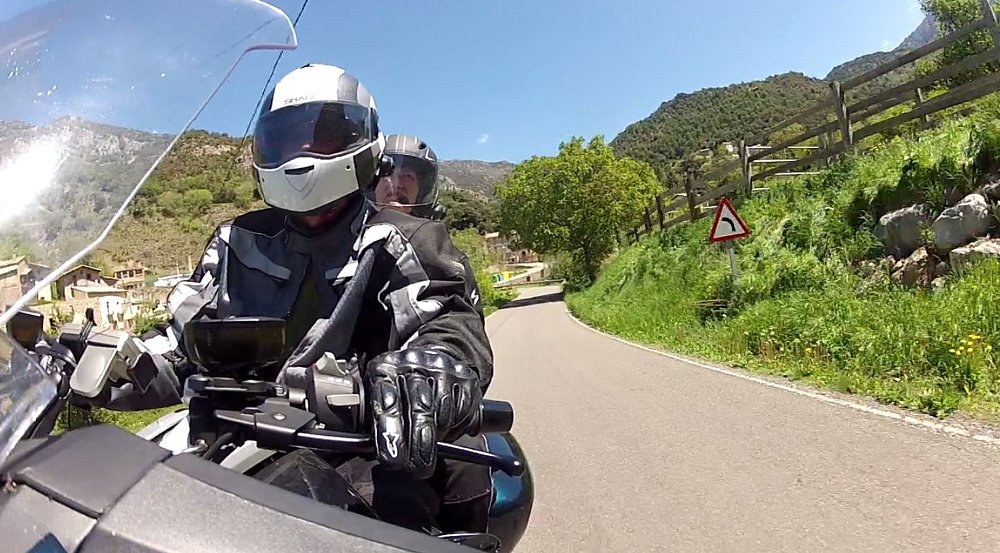 close view of rider and passenger on the road