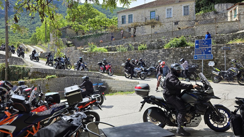 dozens of motorcycles on small village streets in Greece