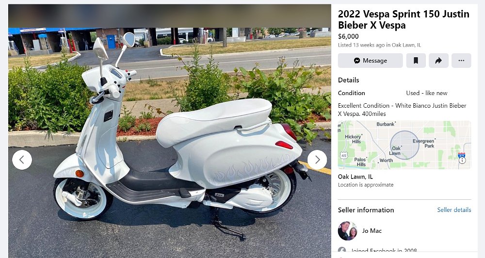 cream and white scooter with ghost flames