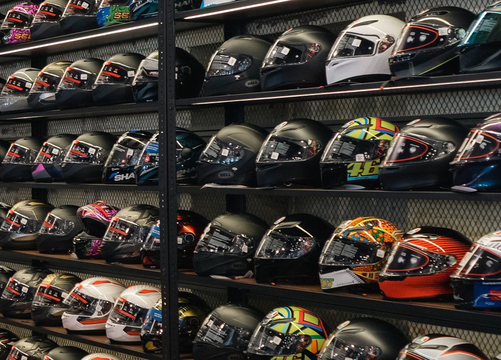 wall of helmets on display at RevZilla store