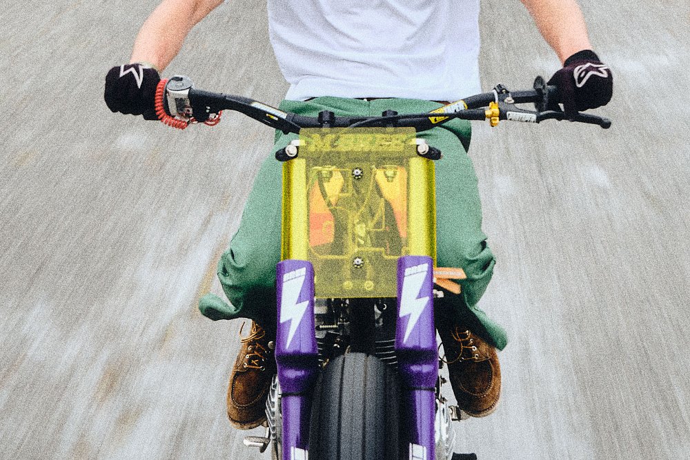 front view of the motorcycle showing an opaque pale yellow number plate