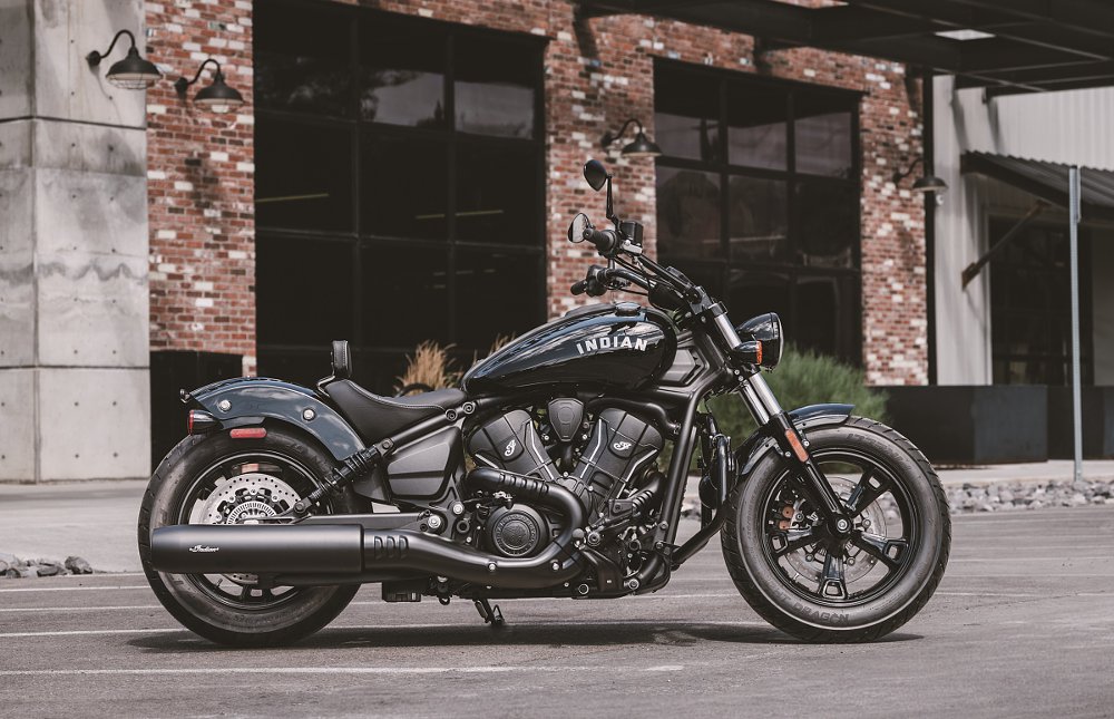 black Scout Bobber parked in front of a building
