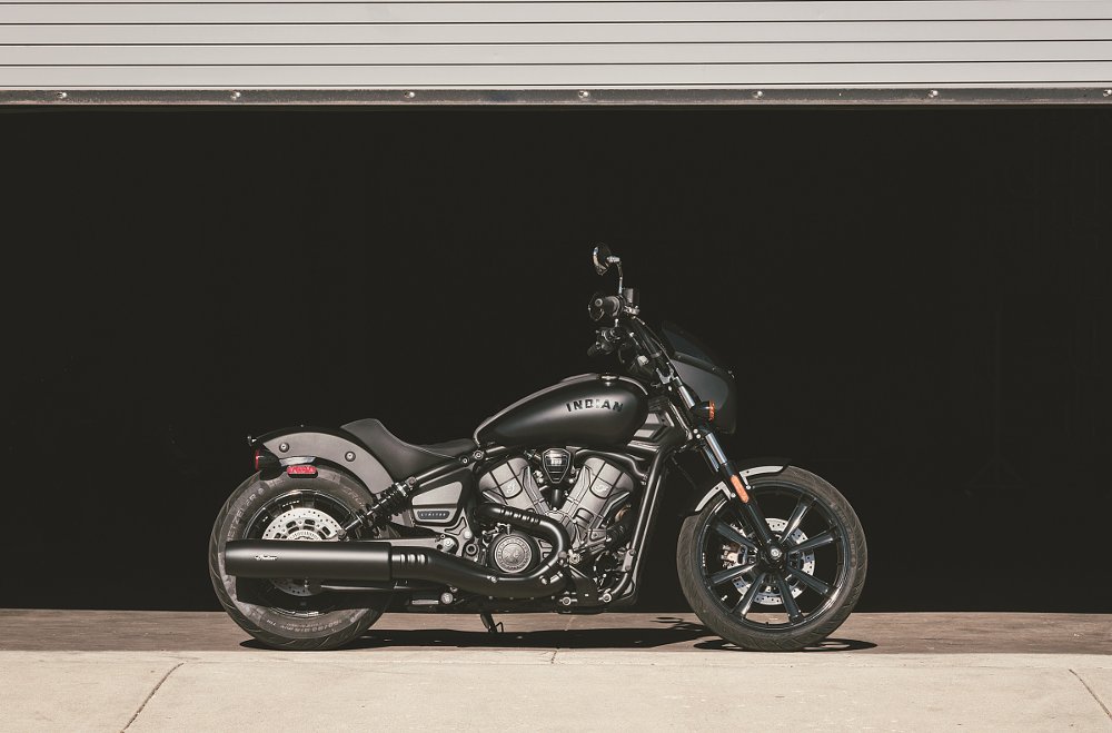 black Sport Scout Sixty parked in front of a building
