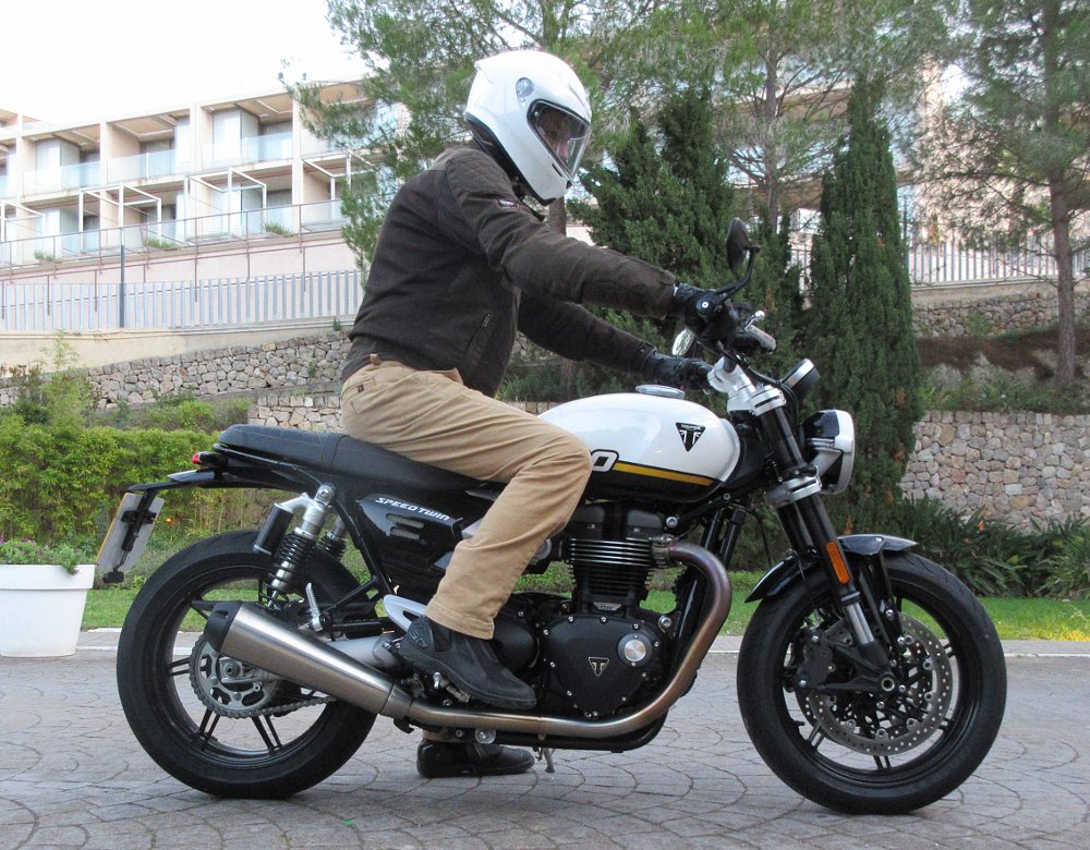 side view of the rider sitting on a Speed Twin 1200 to show the upright riding position